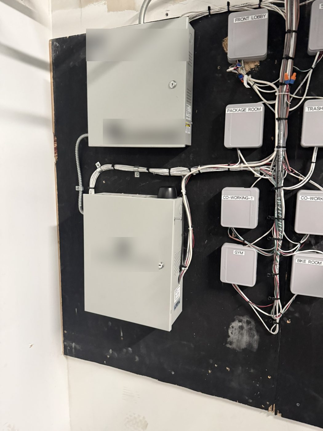 Control enclosures and wired devices on a backboard