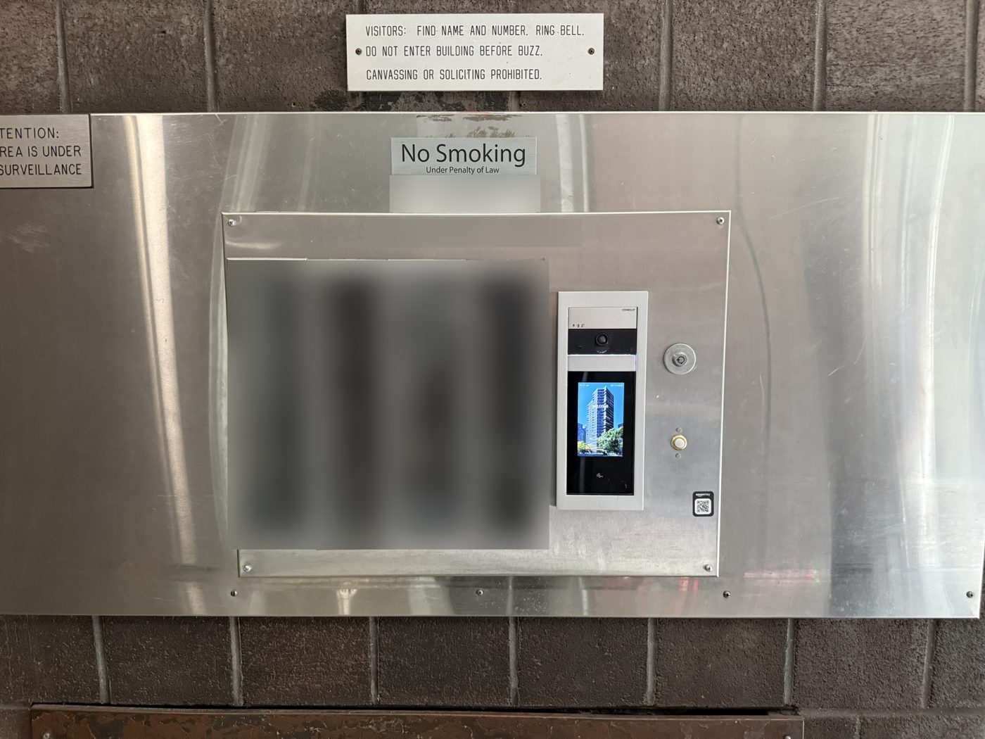 Directory and video entry panel at a building entrance