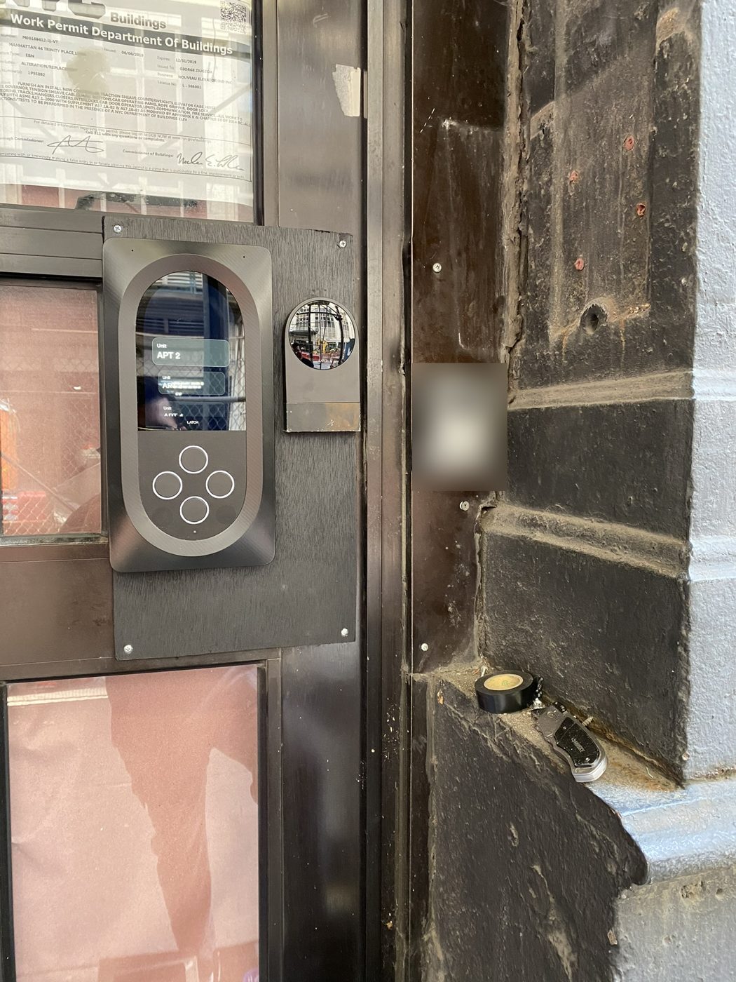 Latch intercom and reader at a building door