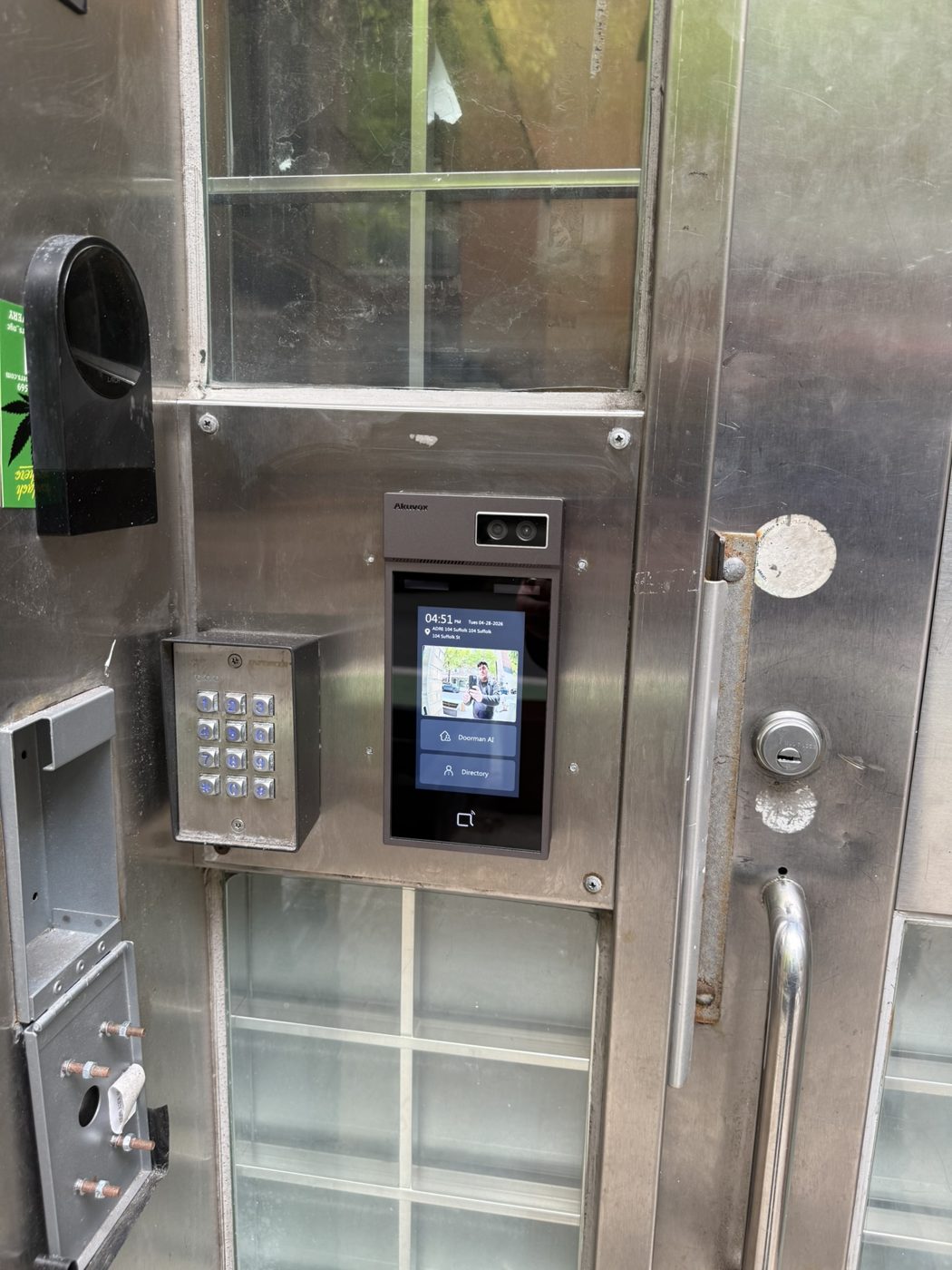 Akuvox intercom with Doorman AI at a building door